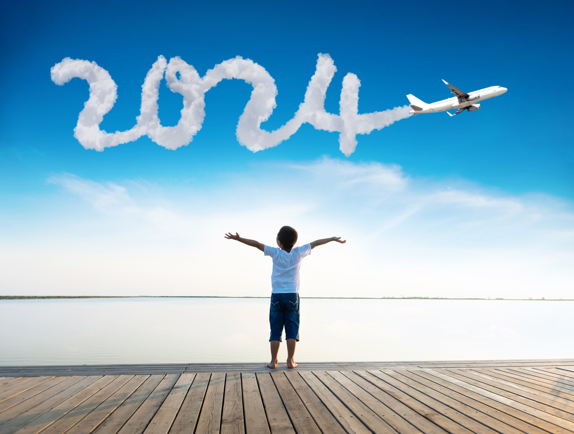 Happy New Year Small Acts Of Kindness Matter And So Does Your Vote   2024 Sign By Plane With Boy Outstretched Arms Image © Baona IStock 1772816797 